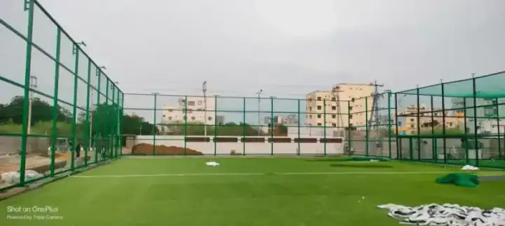 Sports ground net installation with green fencing at facility in OMR Chennai